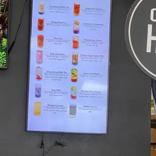 a menu of drinks on a wall