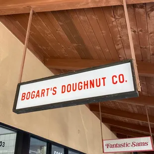 a sign hanging from the ceiling