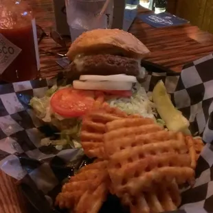 a burger and waffle fries