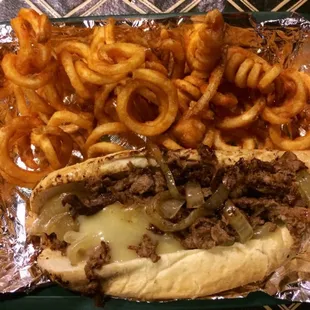 Philly cheesesteak and curly fries