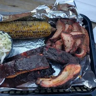 The 4 meat sampler. I got two orders of ribs and tri tip, corn on the cob and slaw.