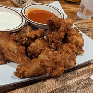 Naked wings with extra hot buffalo sauce on the side
