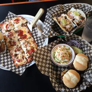 Happy Hour! Delicious flatbread w/perfect crust, lots of cheese; pork carnitas tacos; pulled pork sliders w/slaw to put on top.