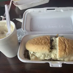a sandwich and a drink on a table