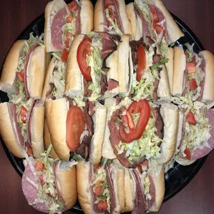 a platter of sub sandwiches
