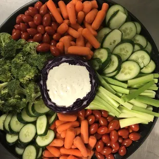 a plate of vegetables and dip