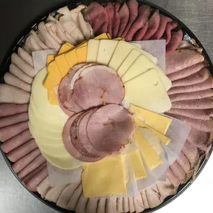 a platter of meat and cheese