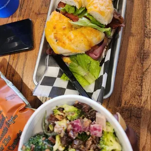 a bowl of salad and a sandwich