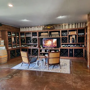 a wine cellar with wine bottles on shelves