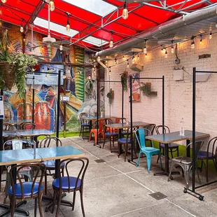 a patio with tables and chairs