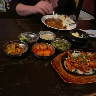 Cheesy Chicken Tonkatsu (far) Chicken Bulgogi (near) Banchan (picked side dishes)