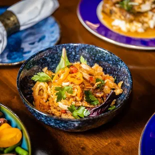 bowls of food on a wooden table