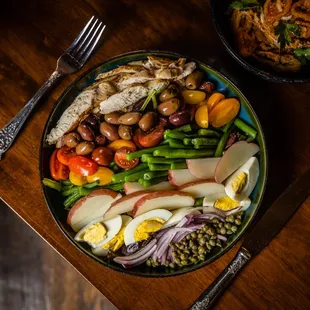 a plate of food on a wooden table