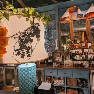 a blue vase with a bunch of flowers on it