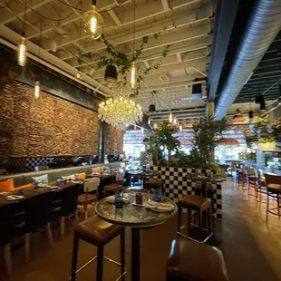 a view of a dining area with tables and chairs