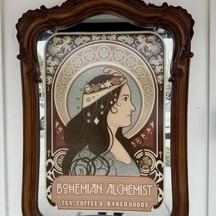 a woman&apos;s profile in a mirror