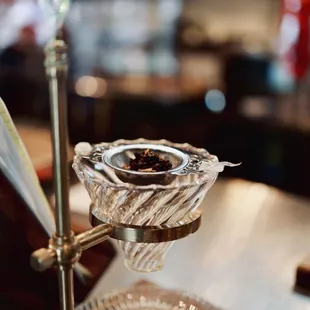 a silver plate with a spoon and spoon rest on it