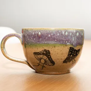 a coffee cup on a wooden table