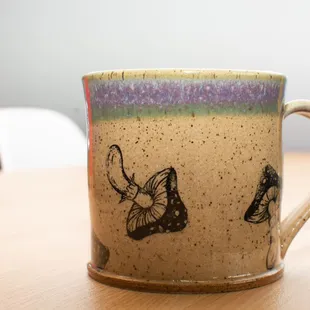 two butterflies on a coffee cup