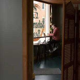 a woman sitting at a table in a cafe