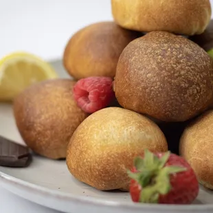 a plate of pastries and fruit