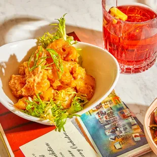 a bowl of food and a drink