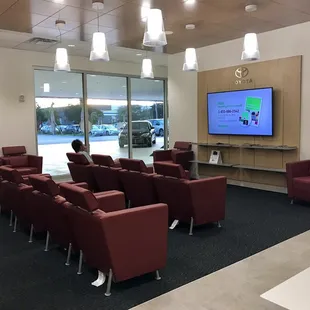 Nice waiting area with leather chairs, tv and magazines! The other side has a keurig with different flavors of coffee, chairs and tables.