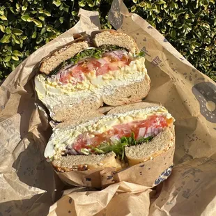Everything Bagel with Pink CC, Egg Salad, Tomato, Red Onion, Sprouts