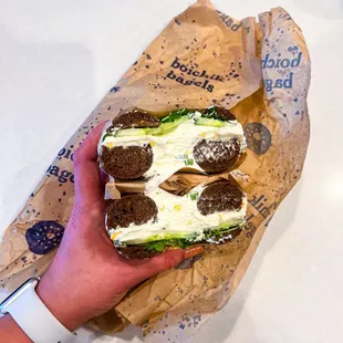 Pumperthingle bagel with horseradish cheddar chive cream cheese, added daikon sprouts and cucumber