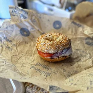 Everything Bagel with Tuna Salad, Red Onions, Tomatoes