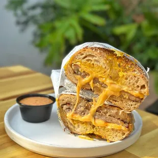 The M.F - La Bahn Ranch Flipped Egg, House-Made Maple Fennel Sausage, New School American Cheese, Side Sweet Onion Aleppo Aoili