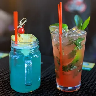 two cocktails on a bar