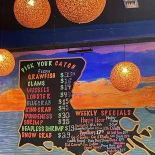 Wall menu for the build your own bucket choices. I&apos;m assuming the prices change with the market.