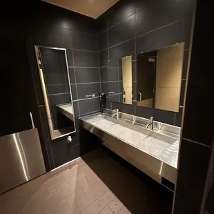 a bathroom with a sink and mirror