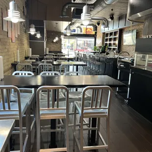 a restaurant with tables and chairs