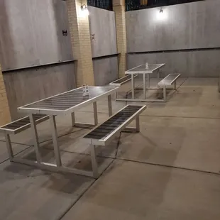a row of stainless steel benches