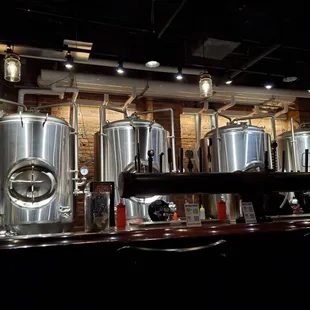 a row of stainless steel tanks