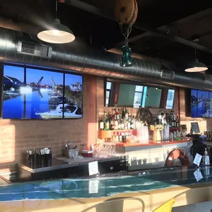 a bar with a large screen tv
