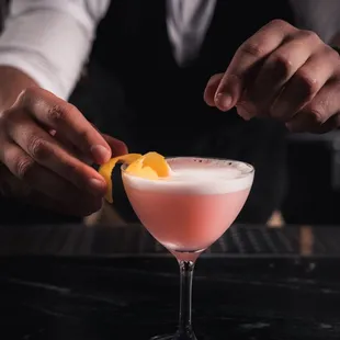 a bartender preparing a cocktail