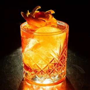 an orange drink in a glass