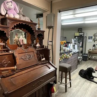 Inside the shop featuring the Pump Organ and the house Dog Shasta.