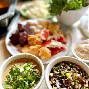 a variety of soups on a table