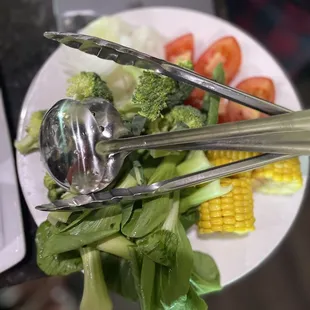 Tomatoes, corn, bok choy, spinach, onions