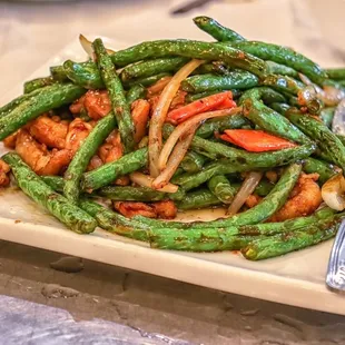 a plate of stir fried green beans