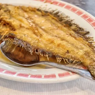 a plate of food with a spoon