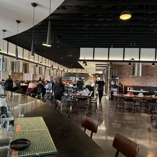 a busy restaurant with people eating