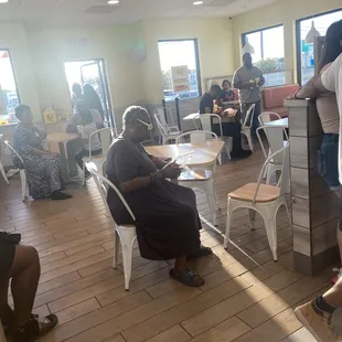 People waiting for their orders inside