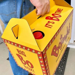 a person opening a box