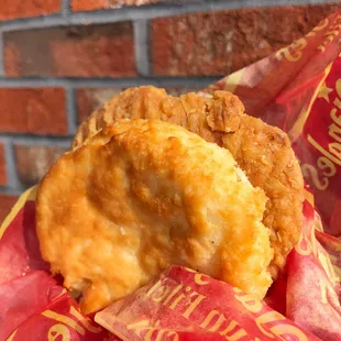 a fried chicken sandwich in a wrapper