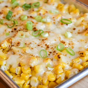 a dish of corn and cheese